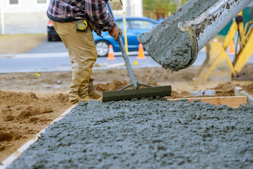 A Concrete truck pouring a foundation