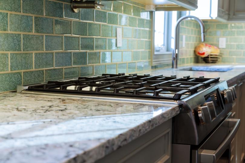 A modern kitchen with sleek concrete countertops