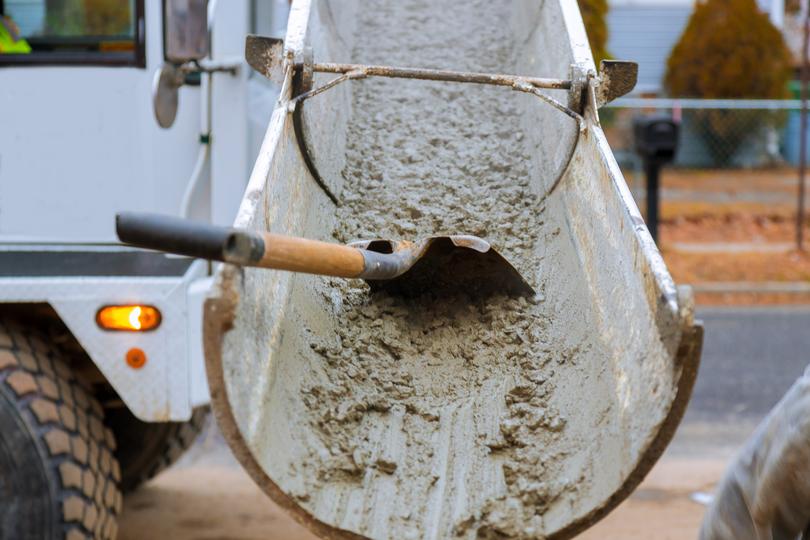 A Concrete truck pouring a foundation