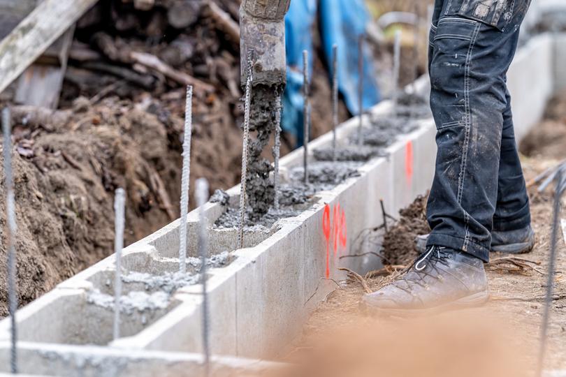 Concrete footings being poured for a new building