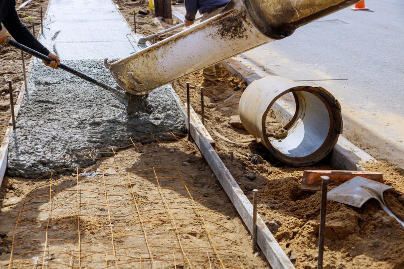 A Concrete truck pouring a foundation