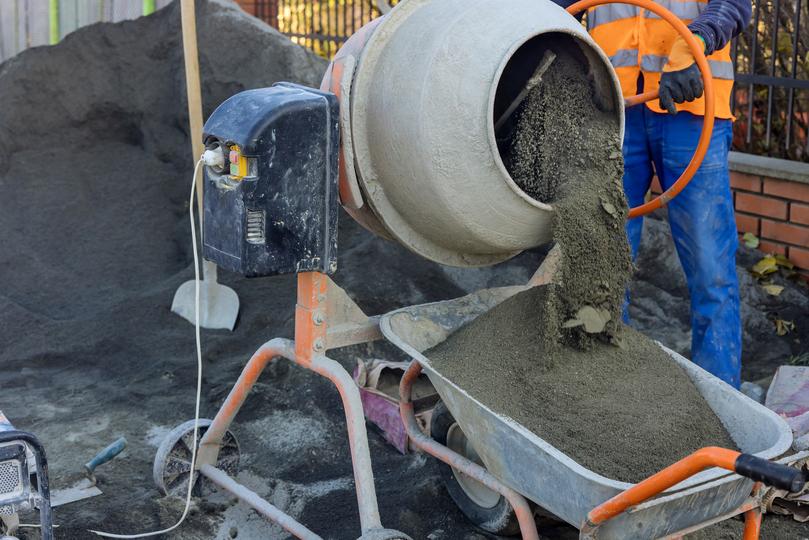 On-site concrete mixer pouring concrete for a foundation