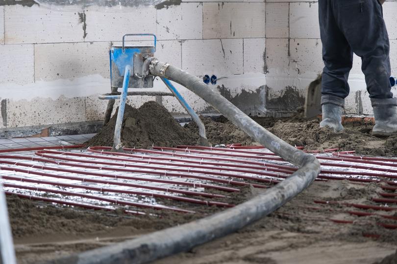 Line pump delivering concrete to a construction site